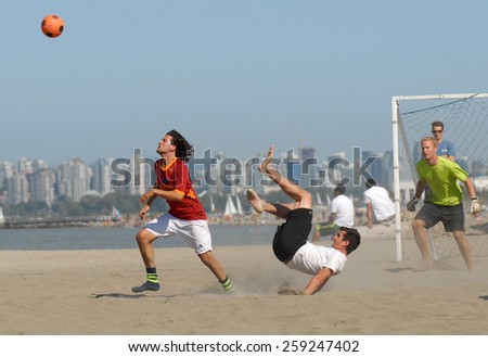 VANCOUVER, CANADA - AUGUST 12, 2012: Athletes battle during the 16th annual Umbro Beach Soccer Blast tournament in Vancouver, Canada, on August 12, 2012.