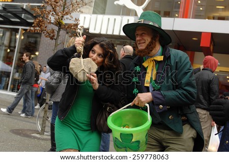 VANCOUVER, CANADA - MARCH 17, 2013: Thousands of people have crowded downtown Vancouver to take part in St. Patrick\'s Day parade and celebrations in Vancouver, Canada, on March 17, 2013.