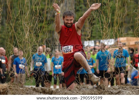WHISTLER, CANADA - JUNE , 2015: Competitors participate in the 2015 Spartan Race obstacle racing challenge in Vancouver, Canada, on June 20, 2015.