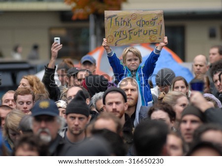 VANCOUVER, CANADA - OCTOBER 23, 2011: Hundreds of people marched the streets to protest against corporate greed, as part of global Occupy movement, in Vancouver, Canada, Oct.23, 2011.