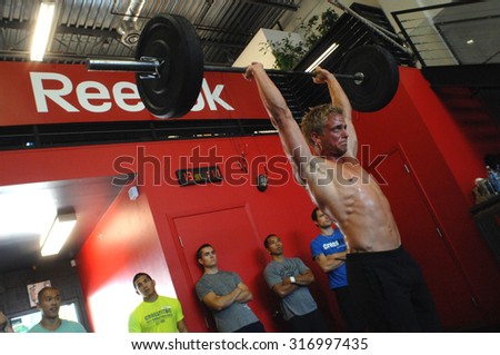 VANCOUVER, CANADA - SEPTEMBER 10, 2011: Athletes show their strength during public event to promote CrossFit sports training in Vancouver, Canada, September 10, 2011.