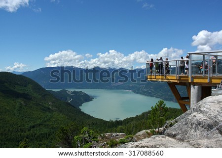 SQUAMISH, CANADA - JULY 7, 2014: People ascend to the top of new 885-metre Sea-to-Sky Gondola attraction for the majestic views of Howe Sound in Squamish, BC, Canada, July 7, 2014.