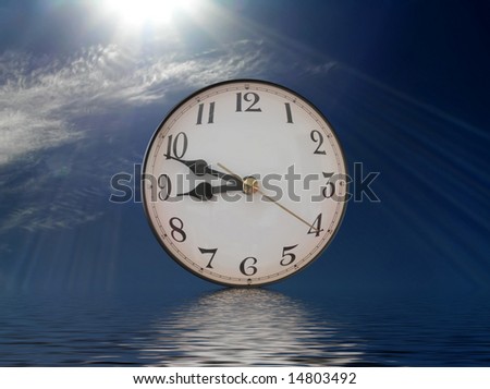 Clock with reflection on rippling water - concept of taking time out to reflect on life.