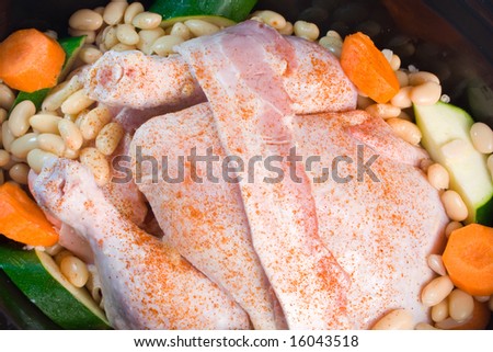 Fresh chicken prepared for cooking in a slow cooker.