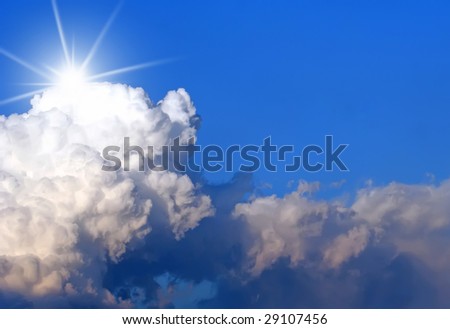 Clouds and blue sky with sun burst and copy space for text.