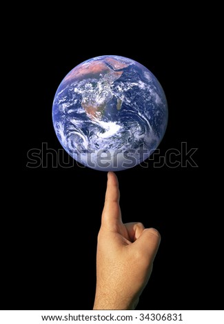 A finger balancing the whole earth with the concepts of environmental awareness and balancing the global economy