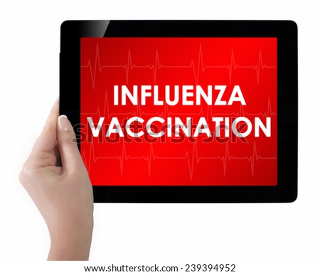 Doctor showing tablet with INFLUENZA VACCINATION text.