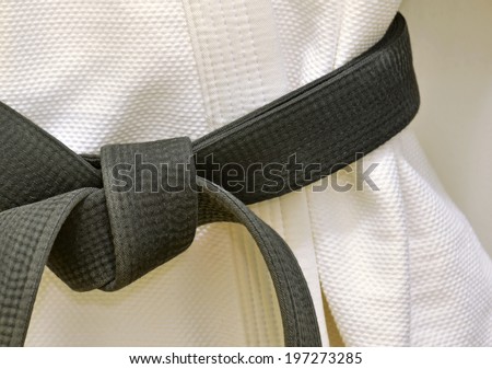 Karate Black Belt on White Uniform
