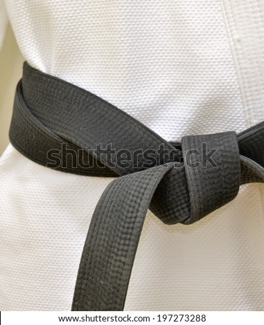 Karate Black Belt on White Uniform