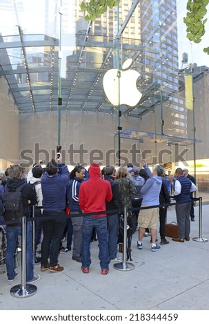 NEW YORK - SEPTEMBER 19, 2014. Thousands of loyal customers wait on long lines stretching many blocks outside the Apple Store in the Upper West Side of Manhattan for the iPhone 6 to go on sale.