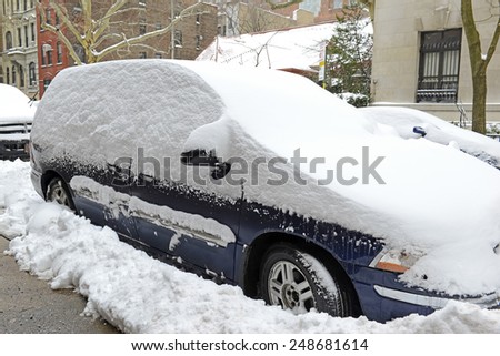 Snow covered car after winter snowstorm, New York City