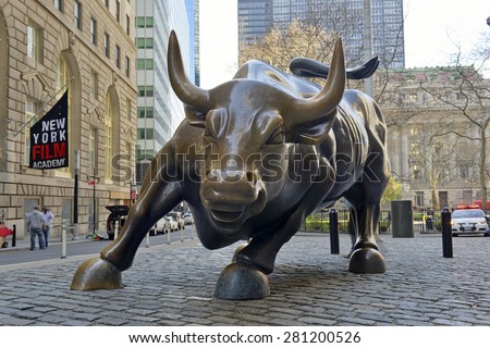 NEW YORK CITY - CIRCA APRIL 2015. Known as a symbol of capitalism and prosperity, the Charging Bull is a Wall Street icon and popular tourist attraction located in downtown Manhattan.