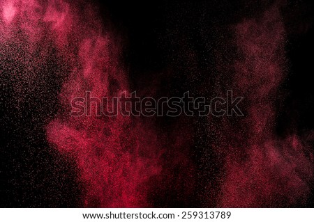 Abstract pink paint Holi. Abstract pink powder explosion on black background.