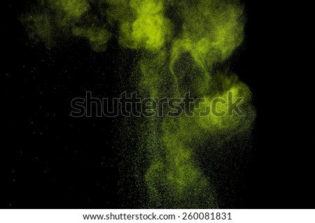 Abstract green paint Holi. Abstract green powder explosion  on black background.
