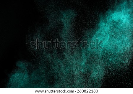 Abstract aquamarine paint  Holi. Abstract aquamarine powder explosion on black background.