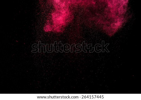 Abstract red and pink paint Holi. Abstract red and pink powder explosion on black background.