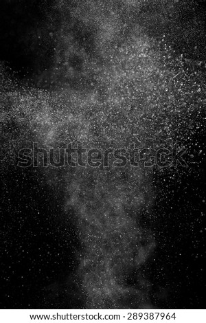 abstract white dust explosion  on a black background. abstract white powder explosion  on a black background.