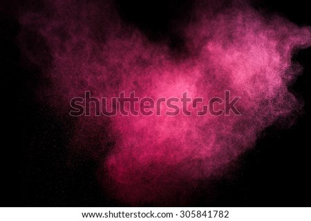 Abstract pink paint Holi. Abstract pink powder explosion on black background. Abstract texture. Design elements.