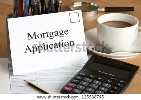 Mortgage application concept with envelope, calculator and pencil