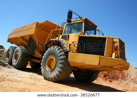 Large yellow earth mover construction truck
