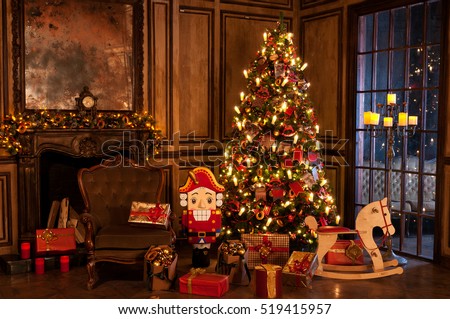 Decorated christmas tree with gifts in a room near fireplace armchair nutcracker and a pony