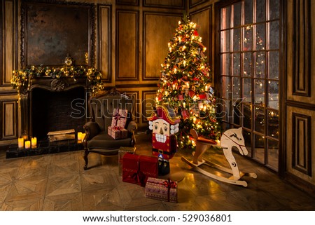 Christmas tree decorated in interior with nutcracker presents and wooden horse near the fireplace