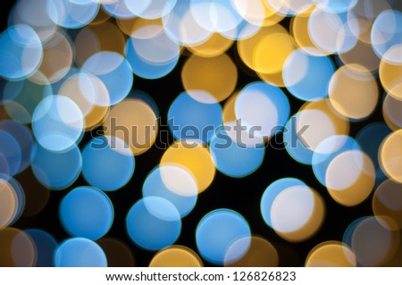 Christmas defocused lights background. Blurred lights background. Bokeh sparkling lights. Abstract circles background.