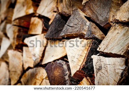 fire wood background texture. closeup of chopped fire wood stack
