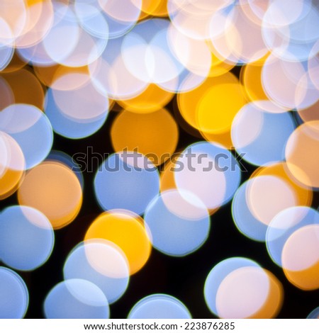 Blurred lights background. Christmas defocused lights background. Bokeh sparkling lights. Abstract colorful background.
