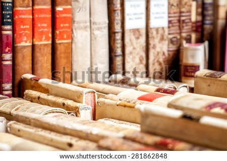 Books with leather covers in a row. Old manuscripts. Aged, used books.