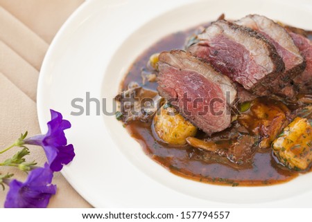 lamb sirloin with herbed gnocchi in brown sauce