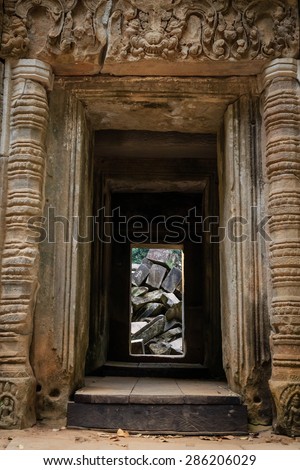 The Fallen Stone of Ta Prohm Temple, with its door frame entering into the building