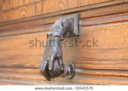 The ancient door handle a beater