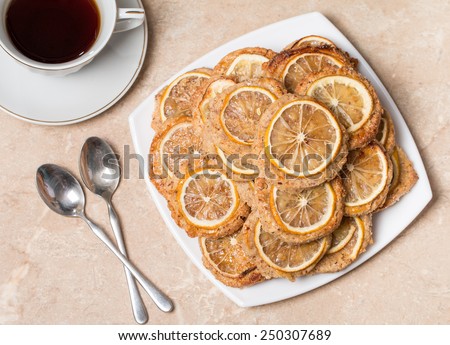 one cup of tea with  homemade almond biscuits with lemon