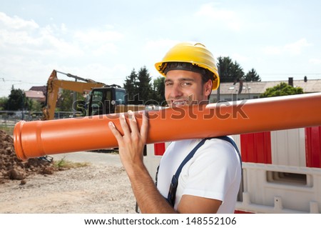 Smiling worker with a water pipe