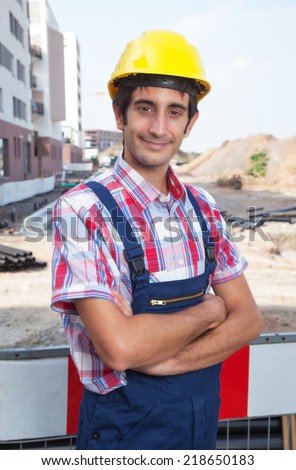 Smiling construction worker with black hair