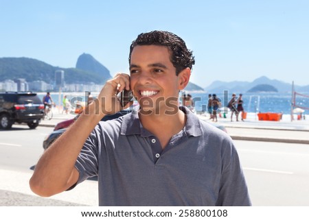 Attractive guy at Rio de Janeiro speaking at phone