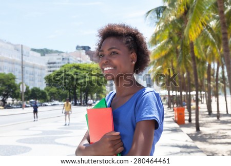 Laughing african american student in the city