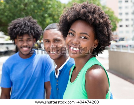African american woman with two friends in the city
