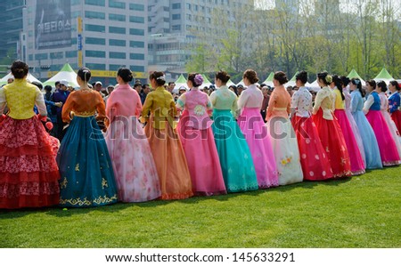 SEOUL, SOUTH KOREA - MAY 4: Korean Models wearing Hanbok, the Korean traditional dress, for photos in front of Seoul City Hall at Seoul Friendship Fair on May 4, 2013.