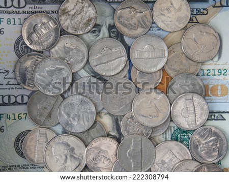 US coins on US dollar banknotes
