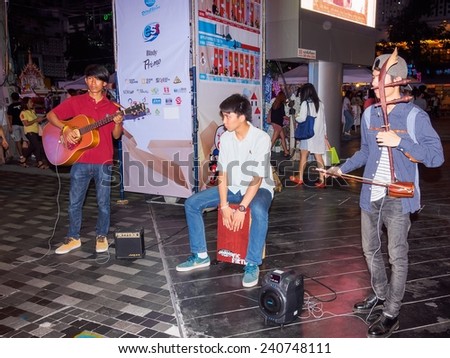 BANGKOK, THAILAND - DECEMBER 21: Unidentified street musicians performing during Siam Street Festival 2014 at Siam Square, Bangkok, in the night of December 21, 2014.