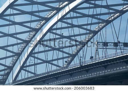 ROTTERDAM, THE NETHERLANDS - NOVEMBER 03, 2012: Detail of the Van Brienenoord bridge, that was built in 1965 (eastern arch) and 1990 (western arch). The bridge is a landmark in the city of Rotterdam.