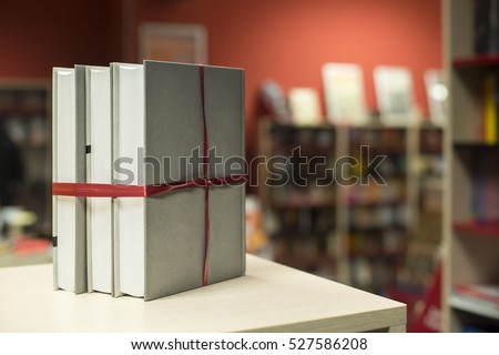 Books gift in a bookstore. Books on shelf on background