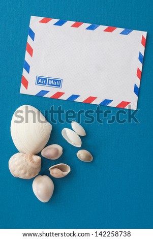 airmail letter and seashells - souvenirs of summer vacations