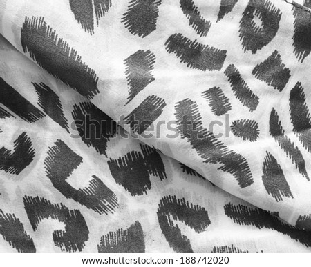 black and white leopard prints on silk textile