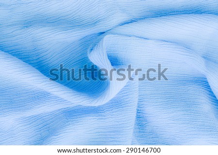 blue cotton textile - close up of fabric texture