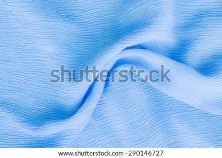 blue cotton textile - close up of fabric texture