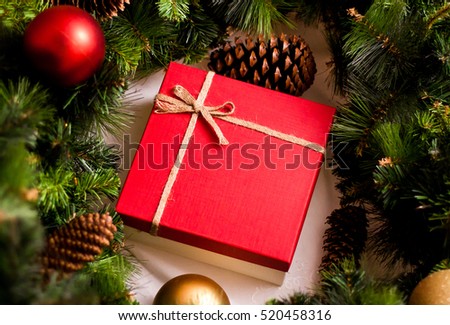 Red luxury New Year gift. Christmas gift. Happy New Year 2017. Christmas background with gift box. Christmastime celebration.