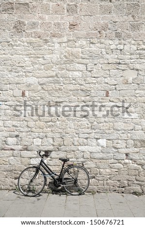 bicycle and brick wall, vintage bike. Retro stylish cycling in town